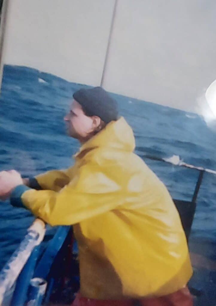 Man on a boat sea fishing