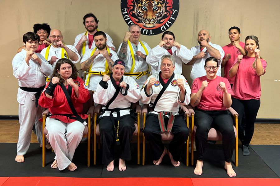 Bancroft NeuroRehab program group at taikwondo studio pose for a photo